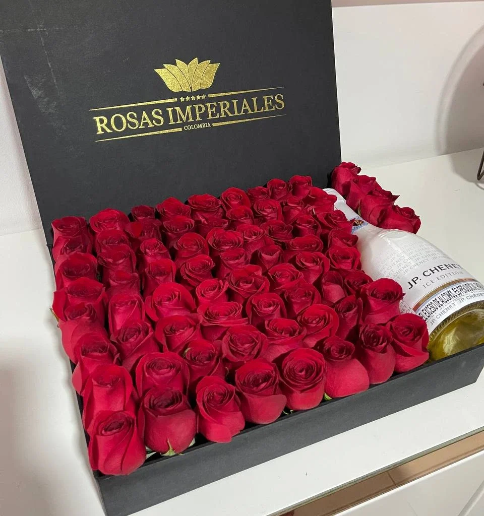 Caja plana con 85 a 90 rosas y botella jp chenet